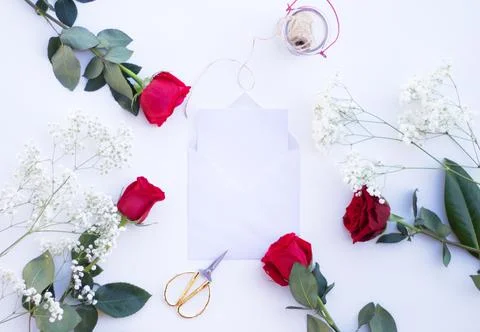 Envelope with card surrounded by floral elements Stock Illustration