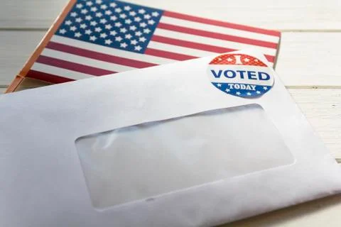 Envelope containing voting ballot papers being sent by mail for absentee vote Stock Photos