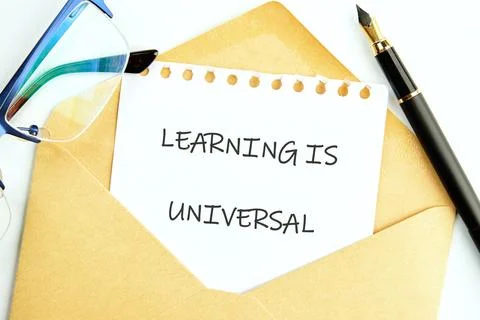 An envelope contains a note stating learning is universal, accompanied by gla Stock Photos