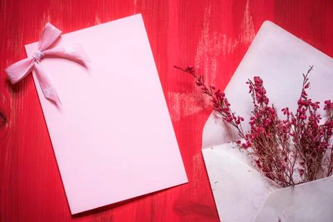 Envelope with flowers and a blank message card Stock Photos