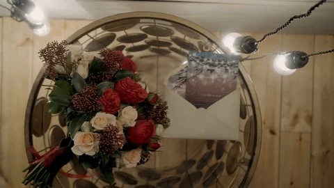 Envelope with flowers on a transparent coffee table Stock Footage 121942726