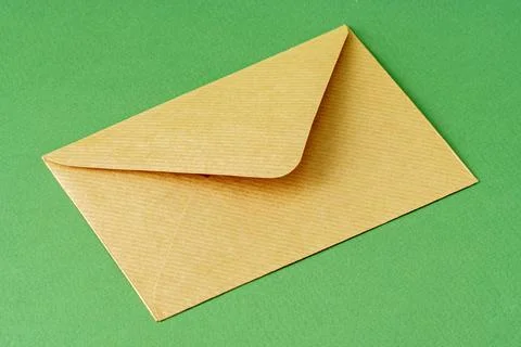 Envelope on green background 写真素材
