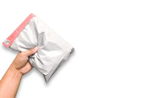 An envelope in the human hand Separate on an intimate white background. High  Stock Photos