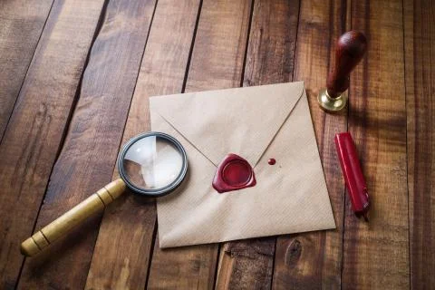 Envelope, magnifier, seal Stock Photos