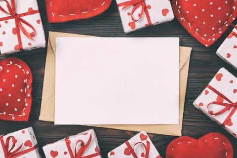 Envelope Mail with Red Heart and gift box over Dark Wooden Background. Vale.. Fotos Stock