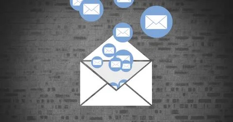 Envelope with message icons on a brick wall Stock Photos