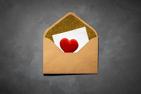 Envelope with paper inside, with copy space, on grey concrete background Stock Photos