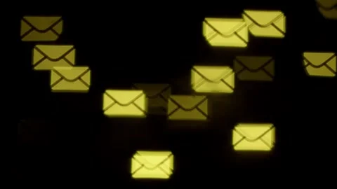 Envelope-shaped bokeh on black background Stock Footage 302080863