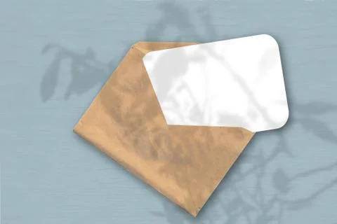 An envelope with a sheet of textured white paper on the greyblue background o Illustrazione stock
