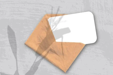 An envelope with sheet of textured white paper on the gray background of the  Stock Photos