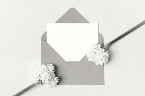 Envelope with spring flowers in colors cloud dancer Stock Photos
