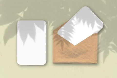 An envelope with two sheets of textured white paper on a blue table backgroun Stock Illustration