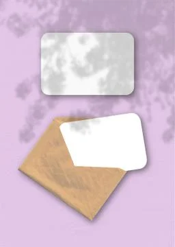 An envelope with two sheets of textured white paper on the pink background of Stock Illustration