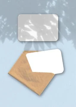 An envelope with two sheets of textured white paper on the blue background of Stock Illustration