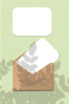 An envelope with two sheets of textured white paper on green background. Mock up Stock Illustration