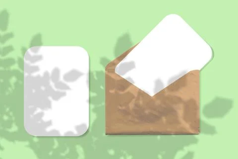 An envelope with two sheets of textured white paper on green background. Mock up Stock Illustration