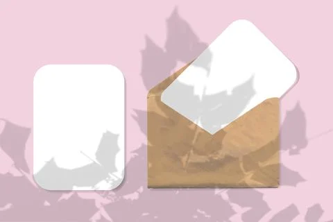 An envelope with two sheets of textured white paper on pink background. Mock up Stock Illustration