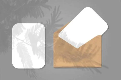 An envelope with two sheets of white paper on grey background. Mock up with an Stock Illustration