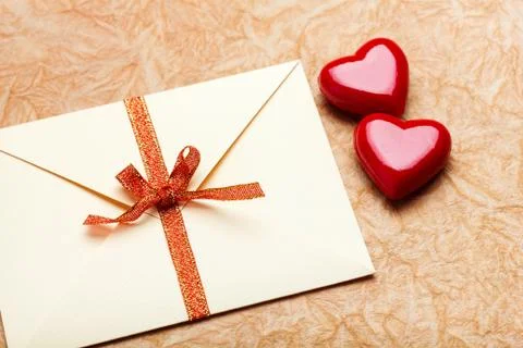 Envelope with valentine card on paper background Stock Photos