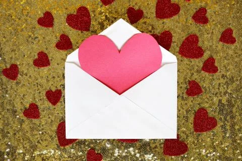 Envelope with Valentine's Day Heart Note and Confetti on Gold Sequin Backgrou Stock Photos