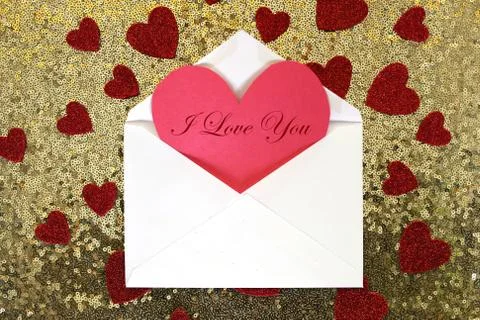 Envelope with Valentine's Day Heart Note and Confetti on Gold Sequin Backgrou Stock Photos