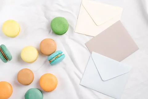 Envelopes colours mockup with macaron on textile background Stock Photos