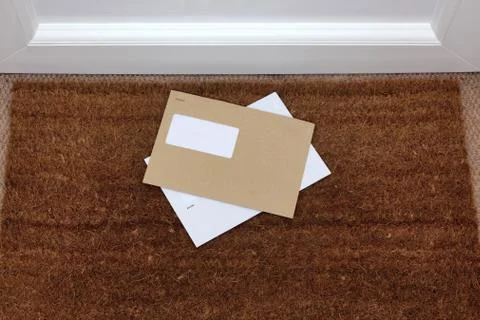 Envelopes on the doormat Stock Photos