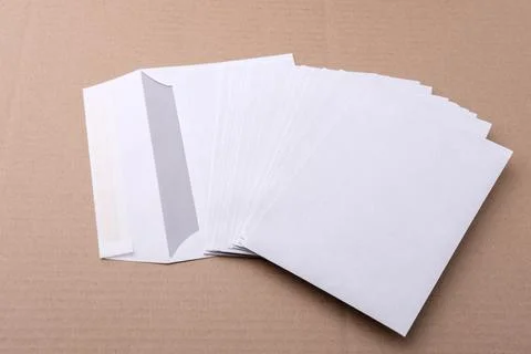 Envelopes for letters are on the table. Stock Photos