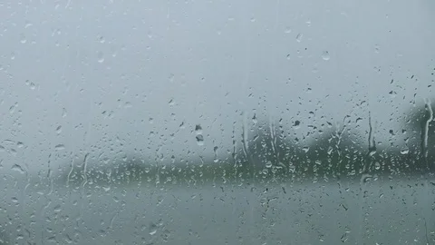 Environment and Ecology Concept. Rain Drop on Glass Window. Rainy Day in Coun Stock Footage 104697079