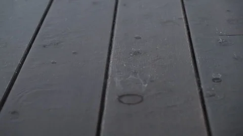 Environment and Ecology Concept. Rain Drop on the Wooden Floor. outside the H Stock Footage 104697245