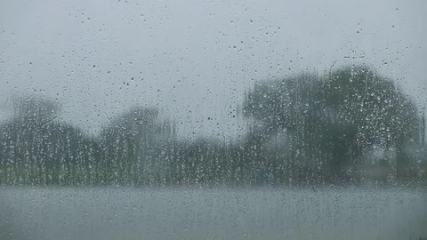 Environment and Ecology Concept. Rain Drop on Glass Window. Rainy Day in Coun Stock Footage 104697333
