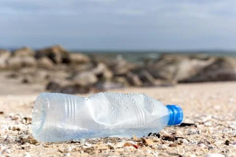Environment concept trash pollution of plastic bottle on the beach. Stock Photos