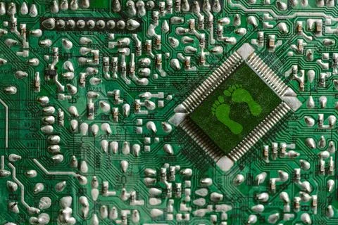 Environment green technology computer chip. Green world icon on circuit boa.. Stock Photos