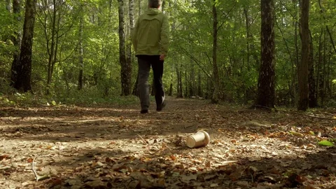 Environment pollution. Man throwing rubbish in the woods, close-up, trash. 2 Stock Footage 95934157