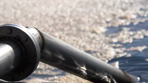 Environment protection concept. Industrial pipe discharging dirty waste Stock Footage 87344708