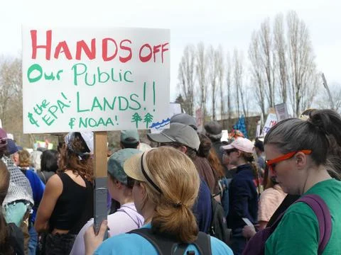 Environmental activists protesting for public lands and the EPA, holding si.. Stock Photos