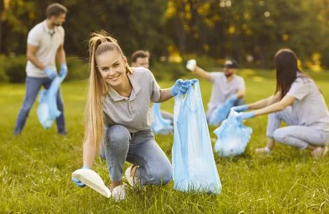 Environmental activists solve ecological problems, collecting plastic litter 写真素材