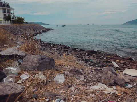 Environmental disaster, ecological pollution, garbage scattered on the ground Stock Photos