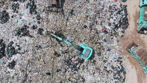 Environmental effect people poor trash truck dirty waste Stock Footage 159118298