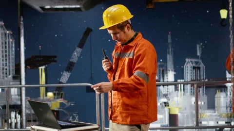 Environmental engineer uses radio communication to inspect offshore platform Stock Footage 324703475
