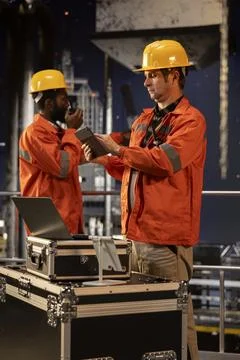 Environmental engineer uses tablet on offshore rig under the northern lights 写真素材
