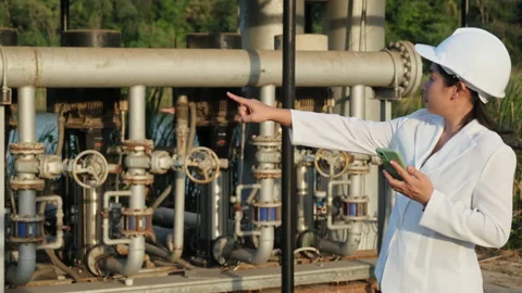 Environmental engineer in white helmet working at wastewater treatment plant. Stock Footage 229705404