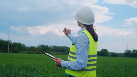 Environmental engineer woman uses project documents and files and collects effec 스톡 동영상 241801654