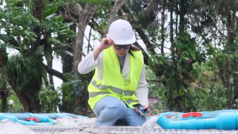 Environmental engineers inspect water quality at wastewater treatment plants. Видео 172395644