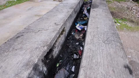 Environmental Harm from Discarded Clothes, Plastics, and Oils Vídeo Stock 305235420