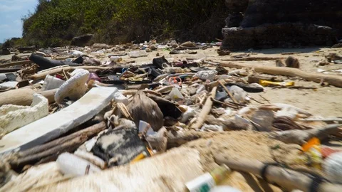 Environmental issues plastic trash littering the ocean shore Stock-Footage 107046682