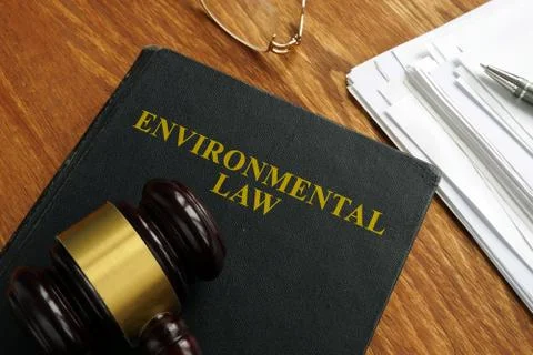 Environmental law book with stack of papers. Stock Photos