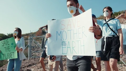 Environmental movement concept. Group of vigorous young people fighting for Stock Footage 113925641
