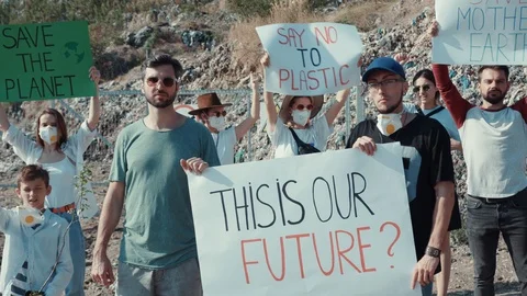 Environmental movement. Concerned ecological activists with posters staying and Stock Footage 113927381