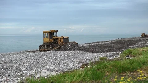 Environmental pollution concept - heavy construction machinery works on seashore Stock Footage 118530071